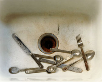 cutlery in sink